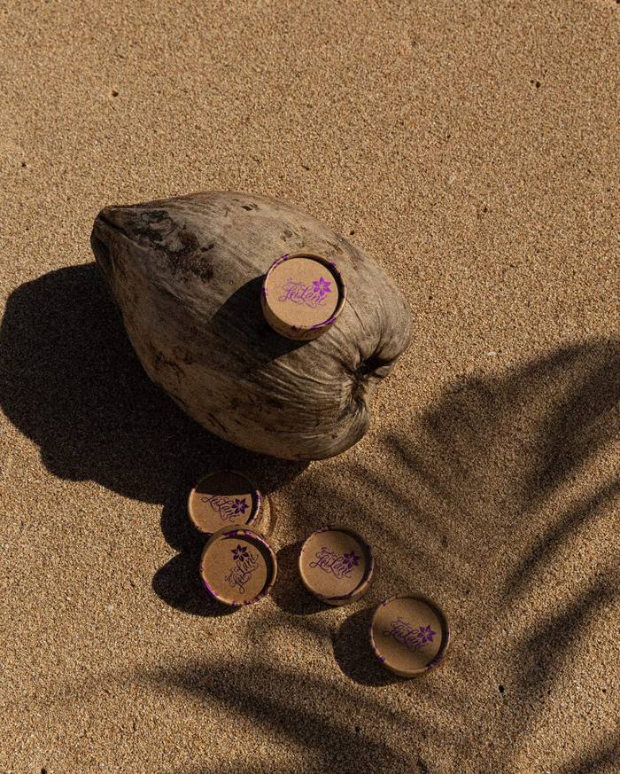 Sweet LeiLani sustainable coconut packaging on the beach